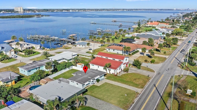 bird's eye view featuring a water view and a residential view