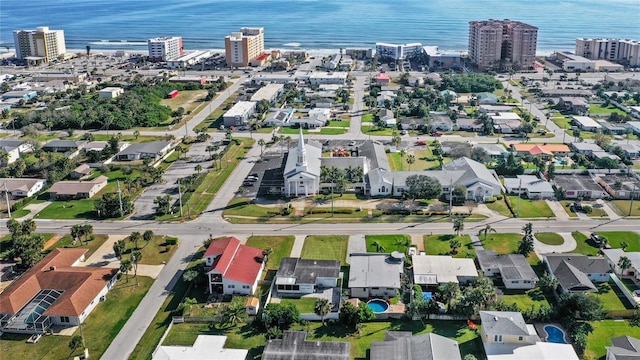 drone / aerial view with a water view and a city view