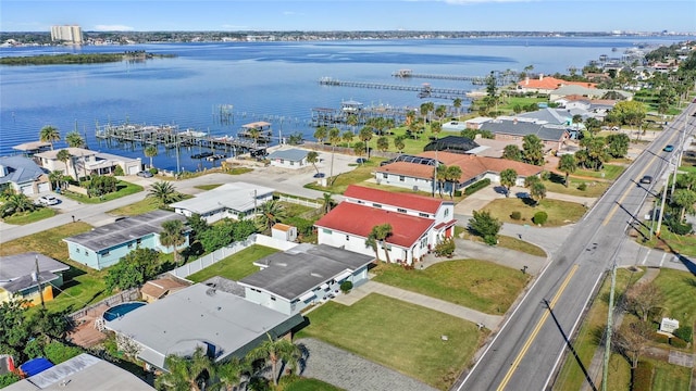 drone / aerial view featuring a water view and a residential view