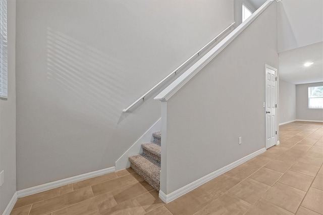 stairway featuring baseboards