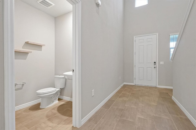 869 Rivers Crossing St, Clermont, FL 34714 - bathroom featuring toilet and baseboards