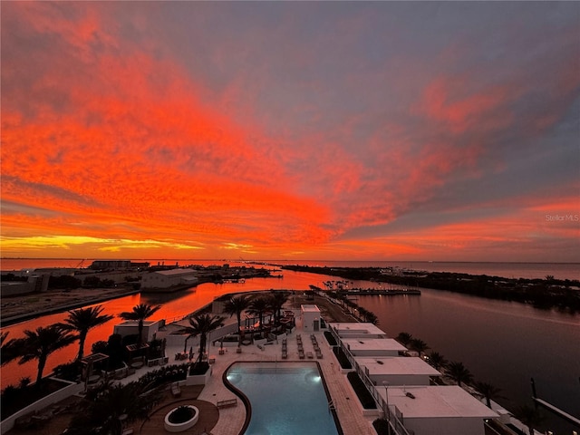 pool at dusk with a water view