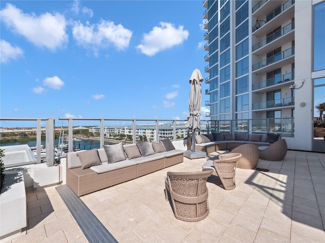 view of patio / terrace featuring an outdoor living space and a water view