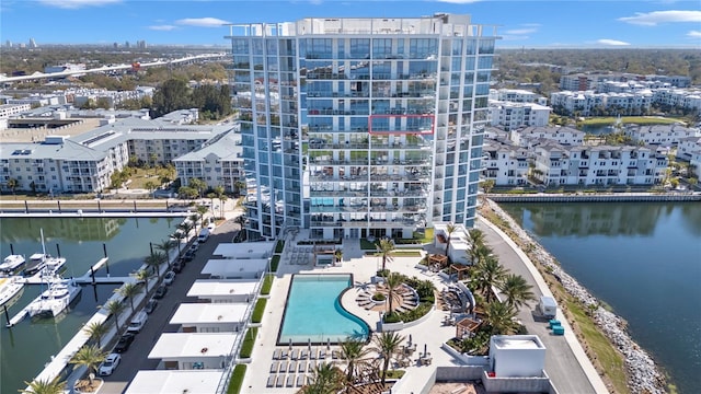 birds eye view of property with a view of city and a water view