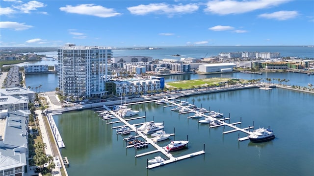 drone / aerial view featuring a city view and a water view