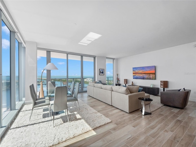 living room with wood finished floors and expansive windows