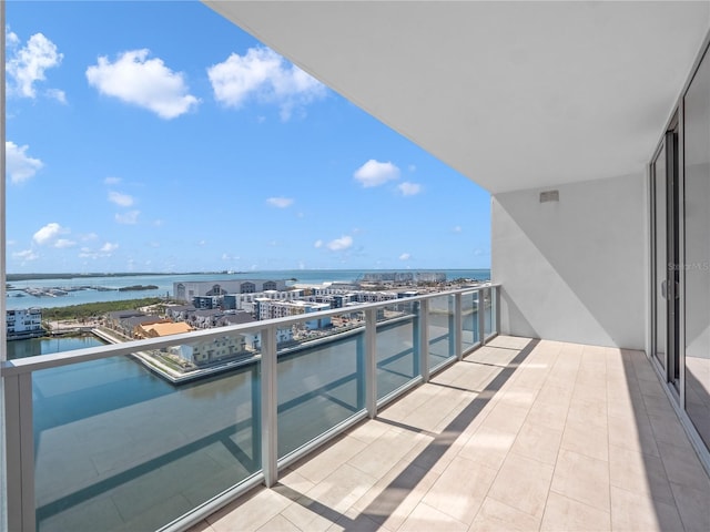 balcony featuring a water view