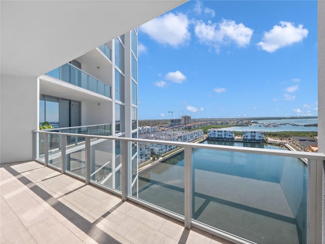 balcony with a view of city and a water view