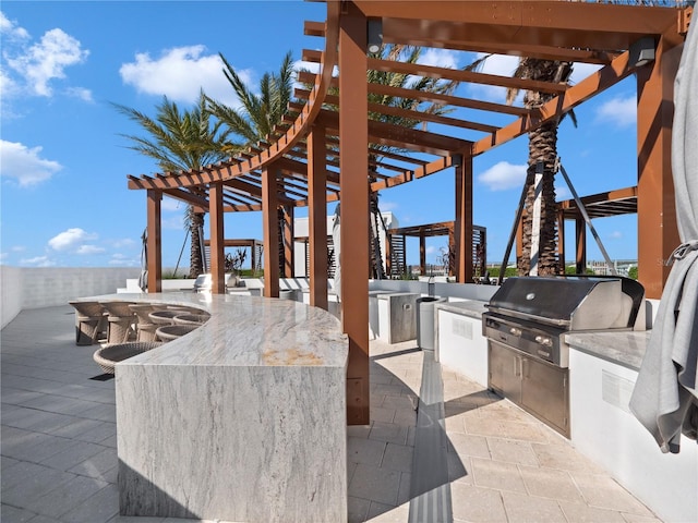 view of patio / terrace featuring outdoor dining space, area for grilling, and a pergola