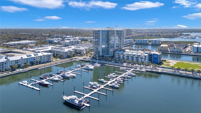 birds eye view of property with a view of city and a water view