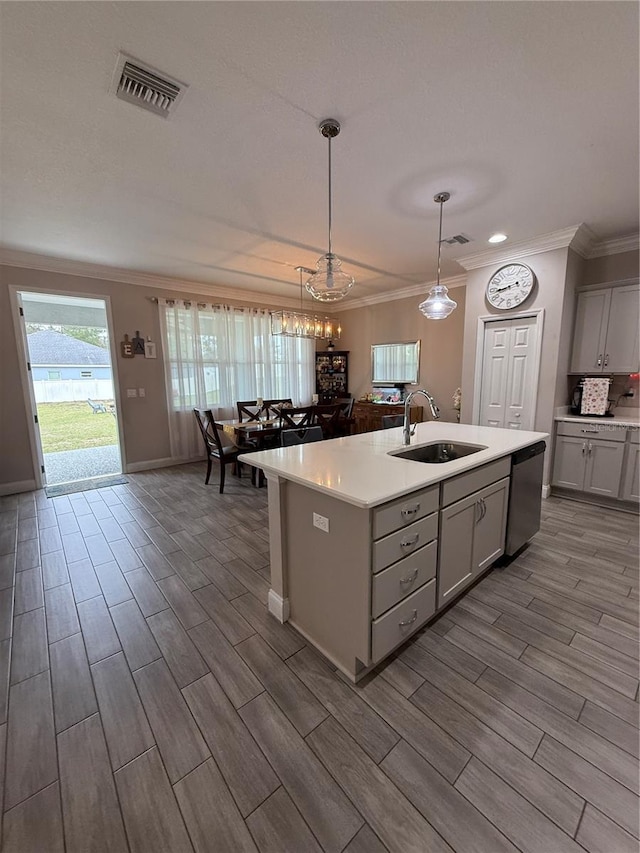 kitchen featuring light countertops, visible vents, gray cabinetry, a sink, and dishwasher