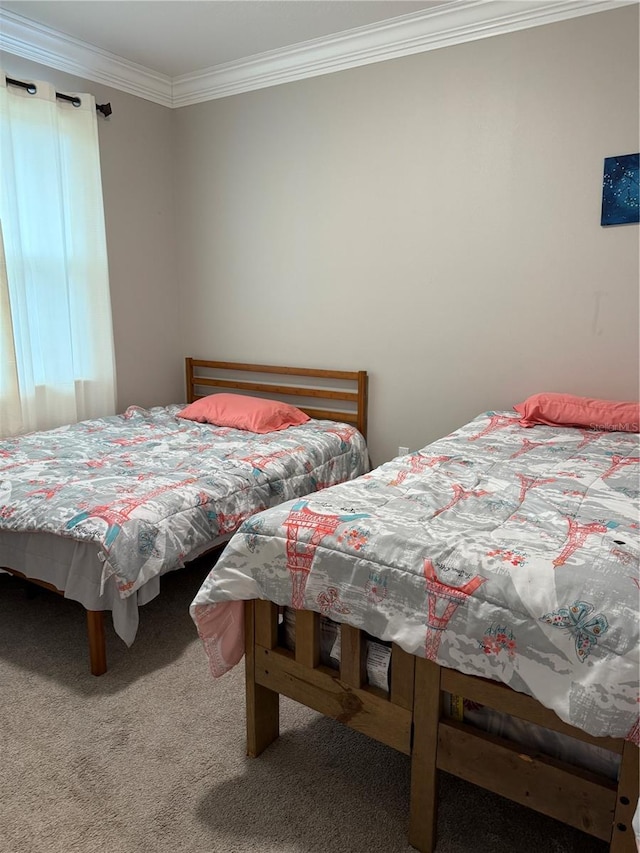 bedroom featuring carpet floors and crown molding