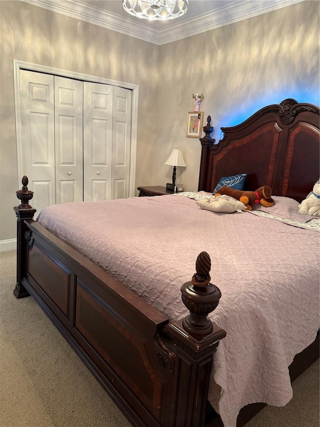 bedroom featuring baseboards, a closet, ornamental molding, and carpet flooring