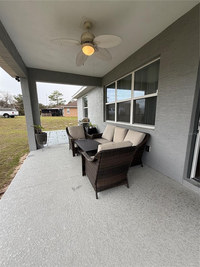 view of patio / terrace with outdoor lounge area and a ceiling fan