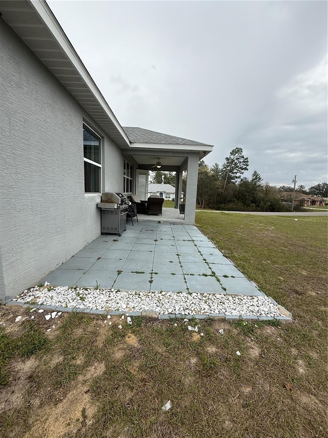 view of patio featuring a ceiling fan and area for grilling