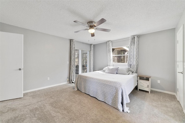 bedroom with a ceiling fan, carpet, and baseboards