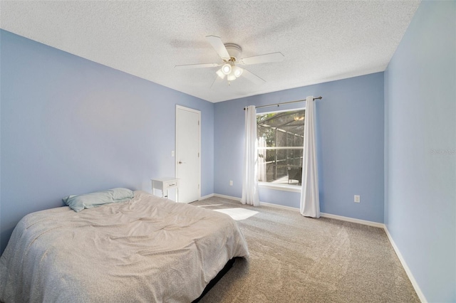 bedroom featuring carpet, ceiling fan, a textured ceiling, and baseboards