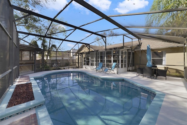 view of pool with a fenced in pool, a lanai, a patio area, and fence