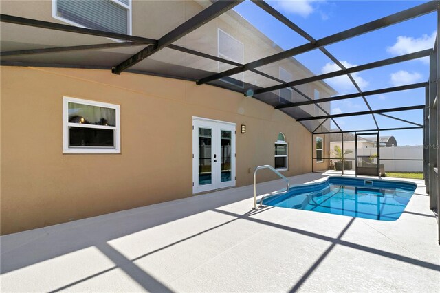 view of pool featuring a fenced in pool, glass enclosure, french doors, and a patio area