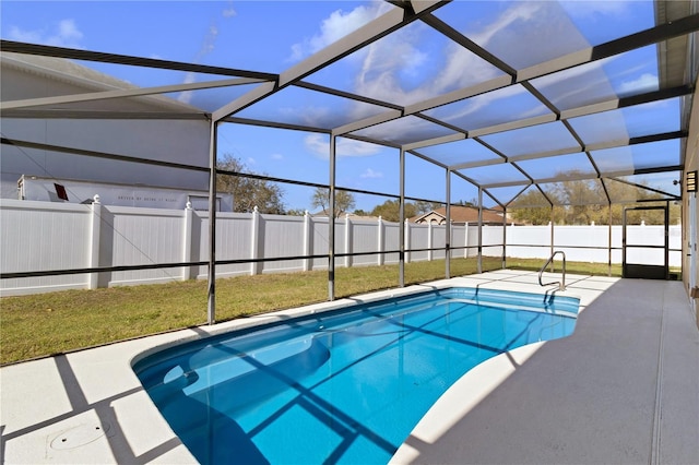 view of swimming pool with a fenced in pool, glass enclosure, a fenced backyard, and a patio