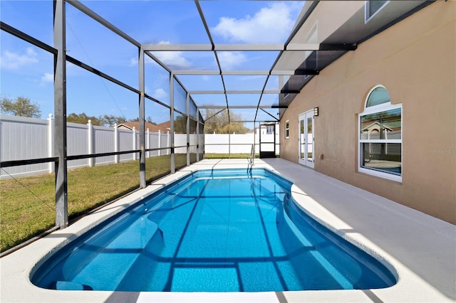 view of pool featuring a patio area, a fenced backyard, a fenced in pool, and a lanai