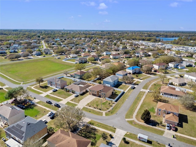 bird's eye view with a water view and a residential view