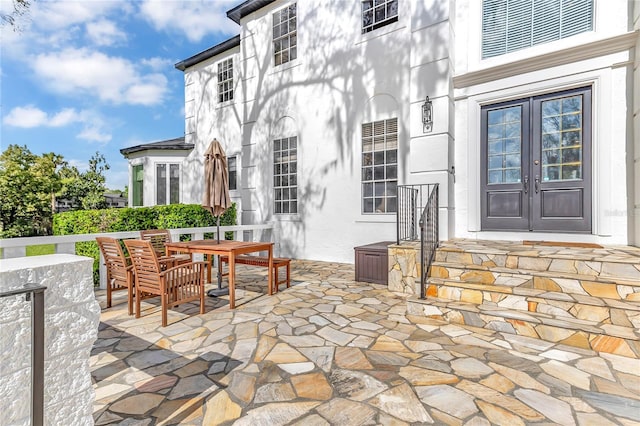 view of patio featuring french doors and outdoor dining area