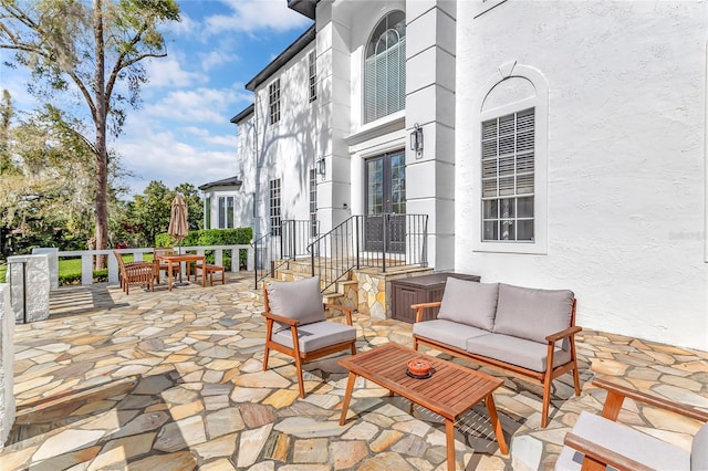 view of patio with outdoor dining space and an outdoor living space