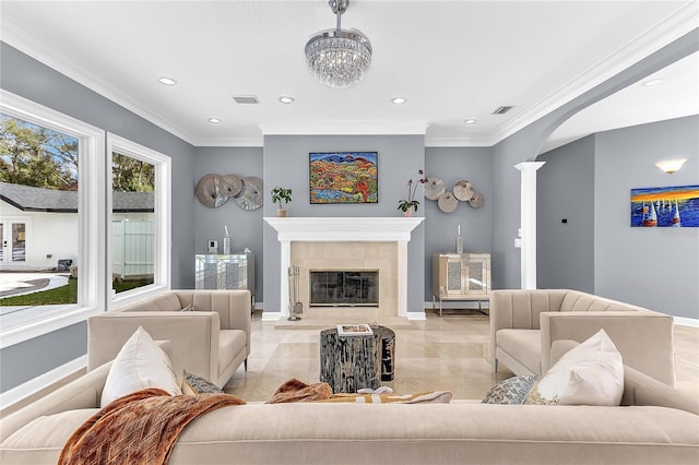 living room with recessed lighting, baseboards, crown molding, and a tiled fireplace