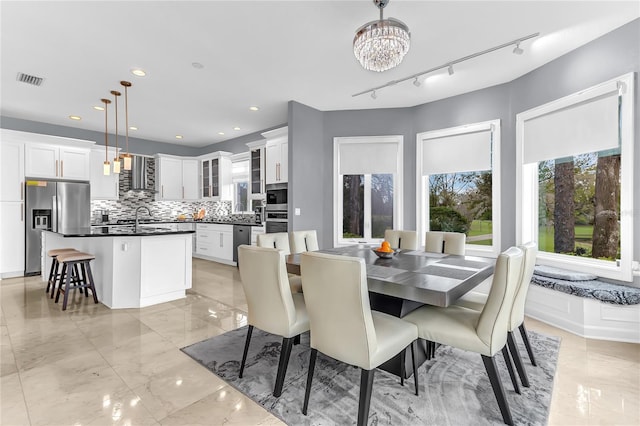 dining room with an inviting chandelier, visible vents, marble finish floor, and recessed lighting