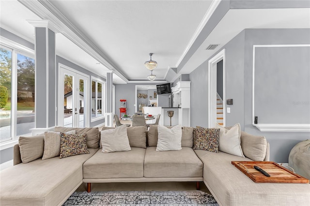 living room featuring french doors, stairway, tile patterned flooring, and crown molding