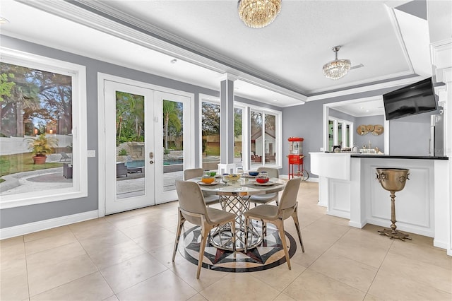 dining space with light tile patterned floors, french doors, baseboards, and crown molding