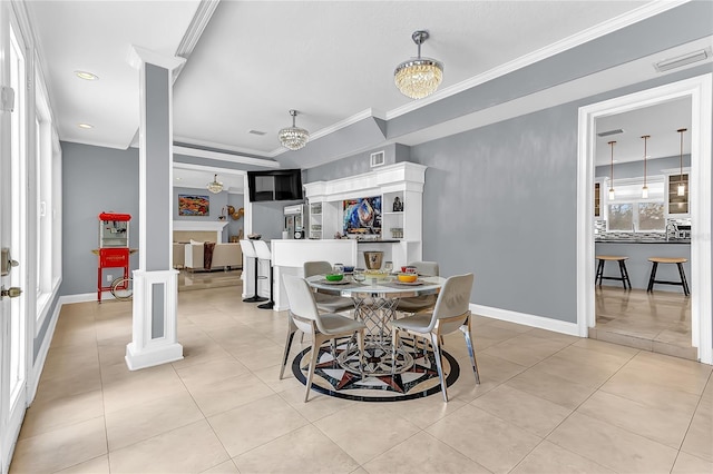 dining room featuring crown molding, decorative columns, light tile patterned floors, visible vents, and baseboards