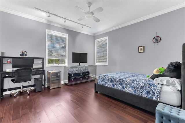 bedroom with a textured ceiling, ceiling fan, crown molding, wood finished floors, and track lighting