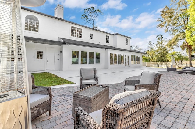 view of patio with fence and an outdoor living space