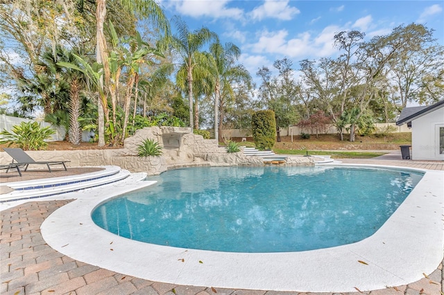 view of swimming pool featuring a fenced in pool, a patio, and fence