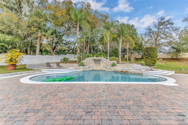 view of swimming pool featuring fence private yard, a patio area, and a fenced in pool