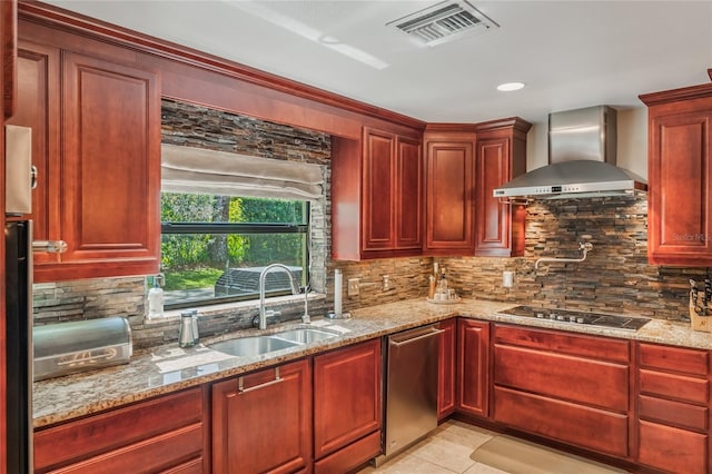 kitchen featuring reddish brown cabinets, wall chimney exhaust hood, visible vents, and stainless steel appliances