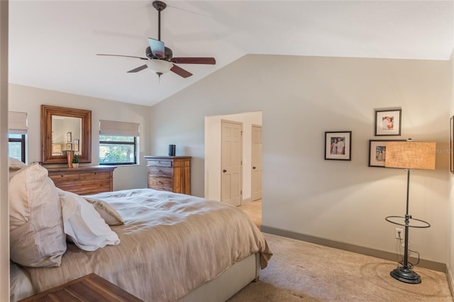 bedroom with lofted ceiling, carpet, baseboards, and a ceiling fan