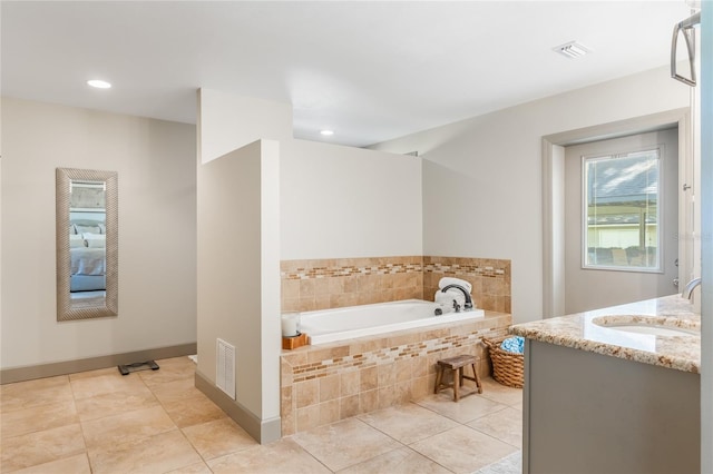 bathroom featuring visible vents, a garden tub, tile patterned flooring, vanity, and recessed lighting