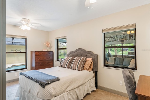 bedroom with carpet flooring, ceiling fan, and baseboards