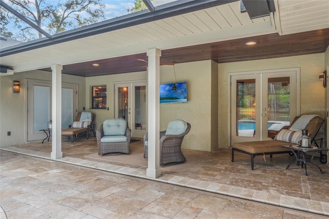 view of patio / terrace with french doors and glass enclosure