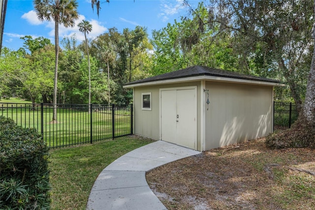 view of shed featuring fence