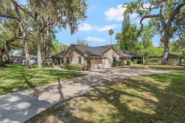 single story home with a front yard, driveway, and fence