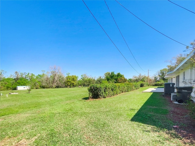 view of yard with central AC