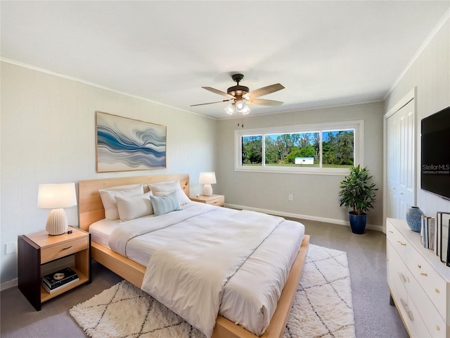 bedroom with ceiling fan, ornamental molding, light colored carpet, and baseboards