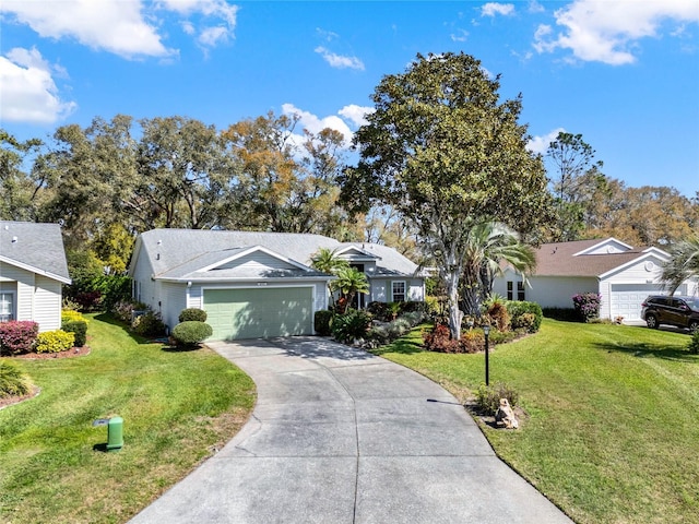 ranch-style house with concrete driveway, a front lawn, and an attached garage