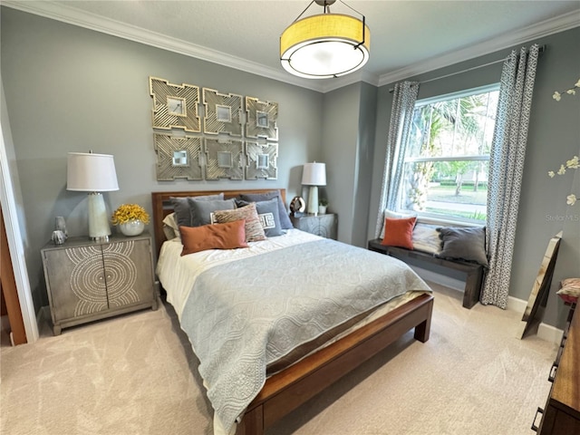 bedroom featuring carpet, crown molding, and baseboards