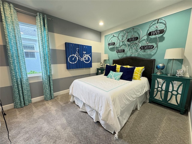 bedroom featuring carpet and baseboards