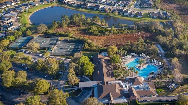 birds eye view of property with a water view and a residential view